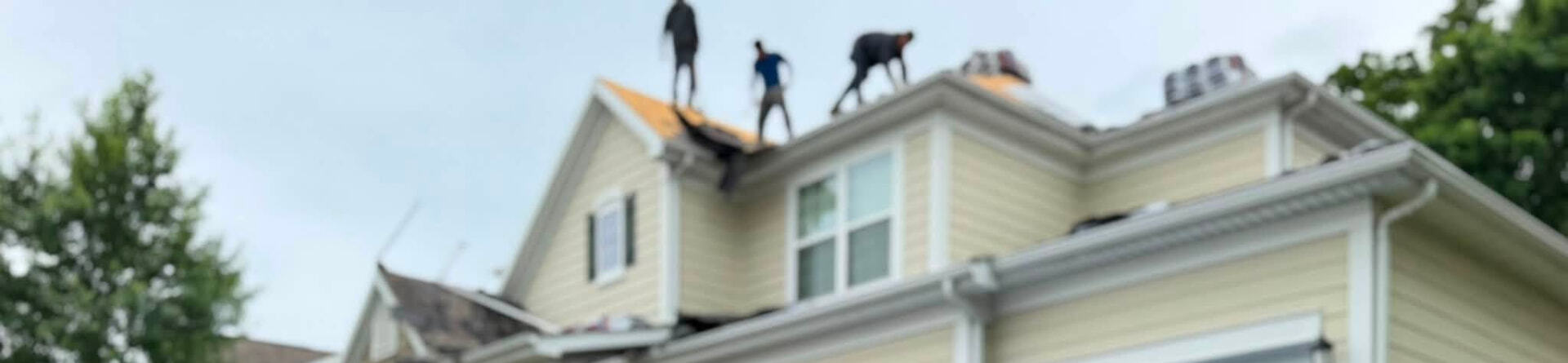 ECI roofing crew replacing shingles on the roof of a Missouri home