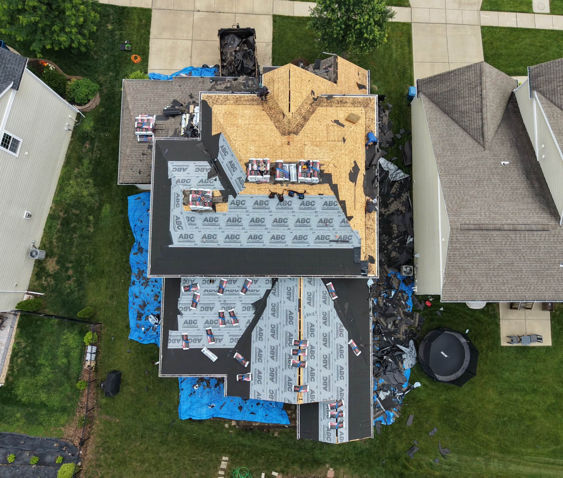 Aerial view of a full roof replacement in progress with new underlayment on a Missouri home